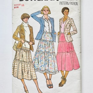 May include: A vintage sewing pattern for a tiered skirt. The pattern is for size 12 and features three different skirt styles. The pattern is from Quick & Easy Butterick and has the number 6051 on it.