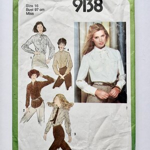 May include: Vintage Simplicity sewing pattern 9138 for Misses' blouses. The pattern envelope is green and white, featuring illustrations of the blouses. The size is 16, with a bust measurement of 97 cm.