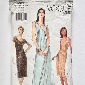 May include: A vintage Vogue Patterns sewing pattern packet. The packet shows illustrations of three dress designs. The front of the packet has the Vogue Patterns logo and the pattern number 9970. The size range is 8-10-12.