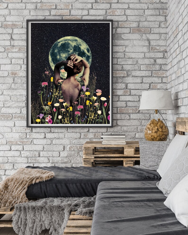May include: A woman with her back to the viewer stands in a field of flowers under a full moon. The moon is green and the sky is dark with stars.