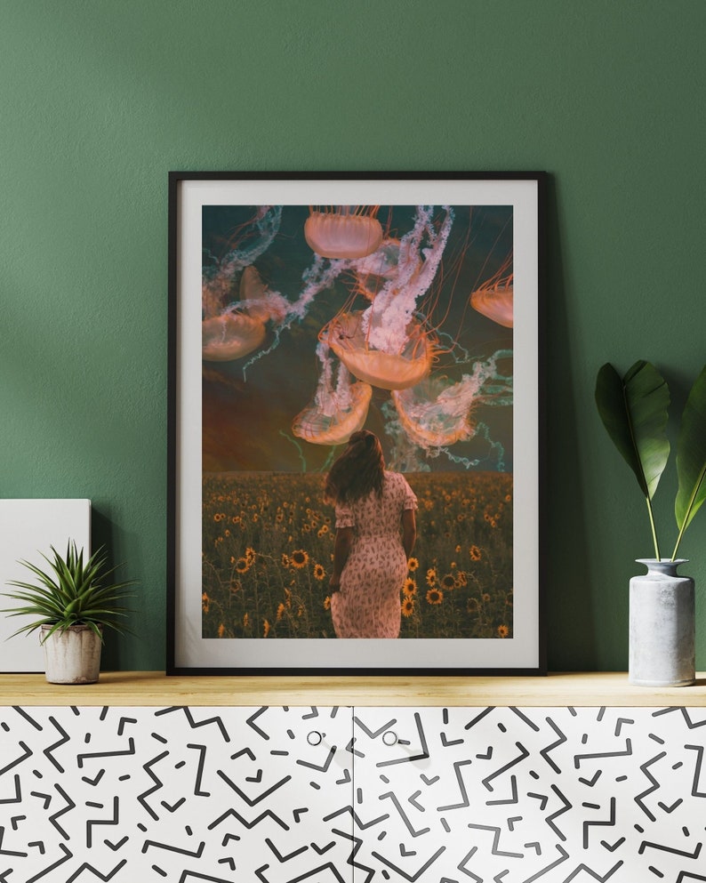 May include: A woman in a white dress walks through a field of sunflowers with a group of jellyfish floating above her.