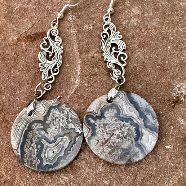 Round Mexico Crazy Lace Agate Earrings with a silver scroll connector