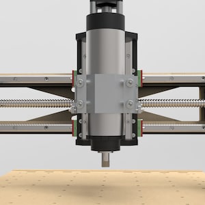 May include: A close-up view of a CNC machine with a black and silver spindle and a wooden work surface. The machine has a silver and black linear rail system and a silver and black lead screw.