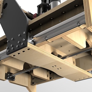 May include: Close-up of a wooden machine with a black metal arm and a silver metal track. The machine has a threaded rod and a series of holes for screws.
