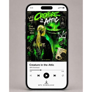 May include: A smartphone displaying a music player interface for the track Creature in the Attic. The cover art features a person with blonde hair facing a glowing green creature, with graffiti-style text and the phrase Fairytales aren't real.