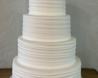 Four  tiers with prepped cutaway for real slice