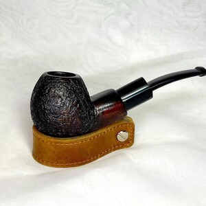 May include: A set of three ceramic mugs with a speckled, matte finish. Each mug features a different color: light blue, cream, and gray. The mugs have a simple, modern design and a comfortable handle.