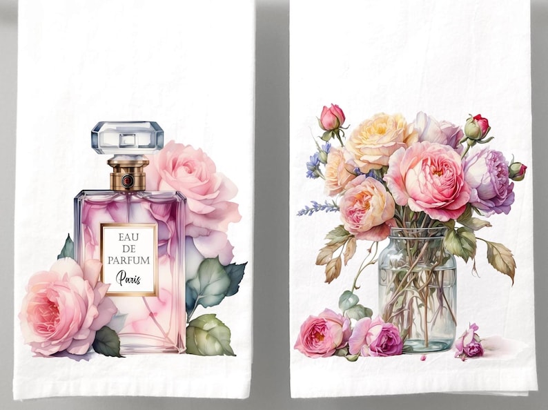 May include: Two white rectangular towels featuring watercolor illustrations. The left towel displays a glass perfume bottle labeled Eau de Parfum Paris surrounded by pink roses. The right towel shows a glass jar filled with a bouquet of pink and purple roses.