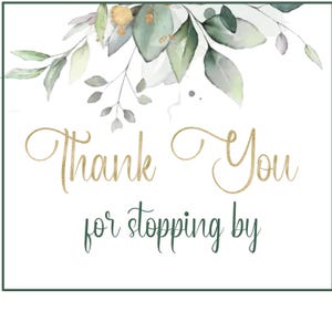 May include: A square card featuring a watercolor illustration of green and grey eucalyptus leaves with gold accents at the top. The text Thank You is written in gold cursive script, and the text for stopping by is in dark green script below.