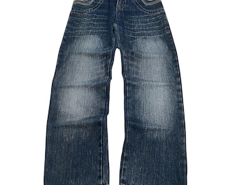 May include: Blue denim jeans with a faded wash. The front pockets have a colorful striped design. The jeans have a classic five-pocket design and a button and zipper closure. The jeans are laid flat on a white background.