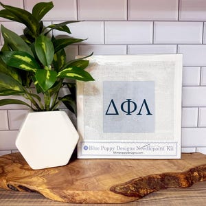 May include: A set of three ceramic mugs with a speckled, matte finish. Each mug features a different color: light blue, cream, and gray. The mugs have a simple, modern design and a comfortable handle.