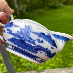 Vintage flow blue small pitcher, creamer, Chinese import, scenic landscape with mountains and trees, vibrant color, mint condition