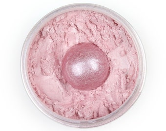 May include: A round container of pink loose powder with a single, round, pink pressed powder compact in the center.