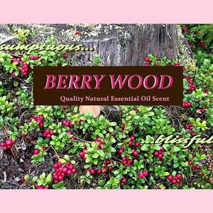 May include: A close-up of a lush green bush with red berries growing on it. The bush is in front of a tree stump and the text "BERRY WOOD Quality Natural Essential Oil Scent" is displayed on a brown banner.