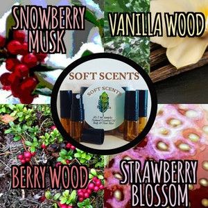 May include: Four small glass bottles with black caps and brown liquid inside. The bottles are labelled "Soft Scents" and "Earth on Herbs". The bottles are arranged in a circle around a white label with the text "(4) 2 ml samples Natural Essential Oil Body & Hair Mist". The image also shows four different images of nature, including snowberry musk, vanilla wood, berry wood, and strawberry blossom.