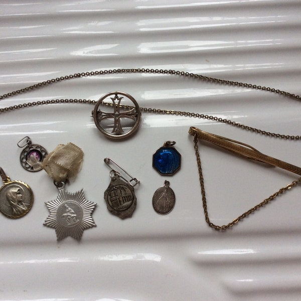 Antique silver brooches , tie pins and medallions