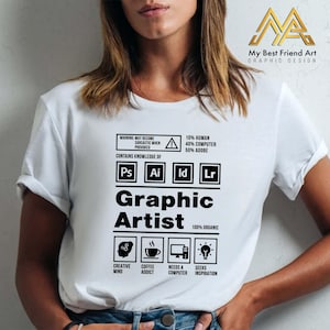 May include: White t-shirt with a black graphic design that says "Graphic Artist". The design includes icons for a creative mind, coffee addict, computer, and inspiration. It also includes the text "WARNING: MAY BECOME SARCASTIC WHEN PROVOKED", "CONTAINS KNOWLEDGE OF", "Ps Ai Id Lr", "10% HUMAN 40% COMPUTER 50% ADOBE", and "100% ORGANIC".