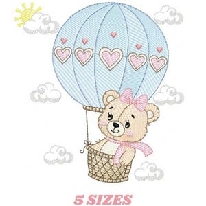 May include: An embroidered design featuring a teddy bear in a hot air balloon. The light blue balloon has pink heart accents. The bear wears a pink bow and scarf. The text "5 SIZES" is below the image.