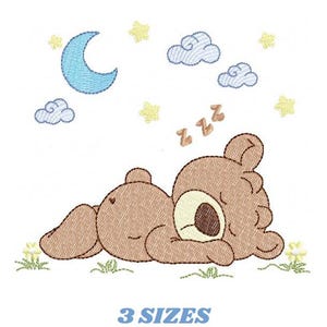 May include: An embroidered design featuring a sleeping brown teddy bear with a cream-colored snout, lying on grass. Above the bear are a blue crescent moon, clouds, stars, and the text "zzz". The text "3 SIZES" is below the bear.