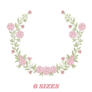 May include: Embroidered floral wreath design featuring pink roses and green leaves. The design is arranged in a semi-circular shape, with the text "6 SIZES" in pink below the wreath. The design is on a white background.