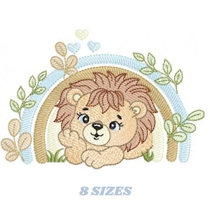 May include: An embroidered design featuring a cartoon lion cub nestled under a pastel rainbow. The lion has a tan mane and is surrounded by green leaves and blue hearts. The text "8 SIZES" is below the image.