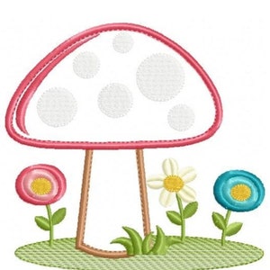 May include: A pink and white mushroom with white polka dots, surrounded by three flowers: a pink flower, a white flower with a yellow center, and a blue flower with a yellow center. The mushroom is sitting on a green patch of grass.