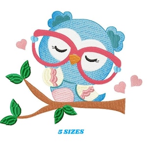 May include: An embroidered design of a blue owl wearing pink glasses, perched on a brown branch with green leaves. Pink hearts float nearby. The text "5 SIZES" is at the bottom.