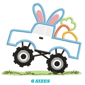 May include: A blue monster truck with bunny ears carrying a pile of orange carrots. The truck is on a green grassy surface. 6 SIZES