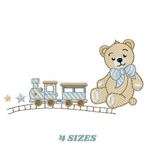 May include: An embroidered design of a tan teddy bear with a blue bow tie and a light blue train with two carriages. The train is on a track with two stars. The text "4 SIZES" is below the image.