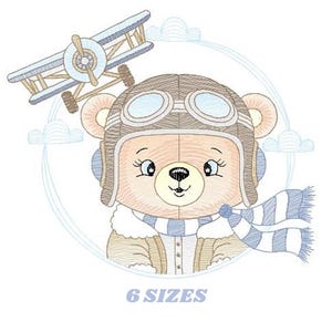 May include: A charming illustration of a teddy bear wearing a pilot's helmet and scarf, with a biplane overhead. The bear is light brown with a blue and white striped scarf. The text "6 SIZES" is at the bottom.