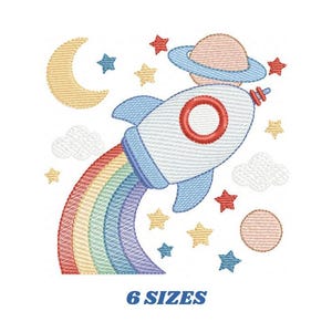 May include: An embroidered design featuring a rocket ship with a rainbow trail, surrounded by stars, clouds, a crescent moon, and a planet. The design is in pastel colors and includes the text "6 SIZES" at the bottom.