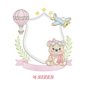 May include: Embroidered design featuring a teddy bear wearing aviator goggles and a scarf, with a hot air balloon and airplane. The design includes a shield shape, laurel branches, a banner, and stars. The text "4 SIZES" is at the bottom.