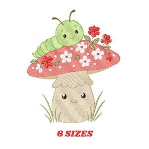 May include: An embroidered design featuring a smiling green caterpillar atop a red mushroom with white flowers and red accents. The mushroom has a smiling face and is surrounded by green grass. The text "6 SIZES" is displayed in red.