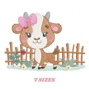 May include: An embroidered design of a cartoon goat with a pink bow, standing in front of a wooden fence. The goat is brown and white with blue eyes and pink cheeks. The text "7 SIZES" is below the goat.
