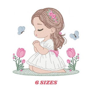 May include: Embroidered design of a girl with brown hair and a white dress kneeling in a field of pink tulips and green grass. She is wearing a flower crown and has her hands clasped in prayer. Two blue butterflies are flying above her.