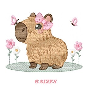 May include: Embroidered design of a brown capybara with a pink bow, standing in a field of pink and white flowers with butterflies flying around. The design is available in 6 sizes.