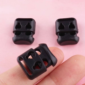 nero Plastica Stopper Cord Fine Toggle Clip Buckle doppio foro Tappo cavo lock per maschera spogliarellista Shoelace Sportswear Accessori cavo corda cavo
