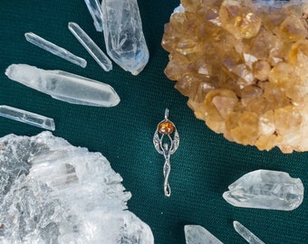 Silver Goddess Holding an Amber Pendant