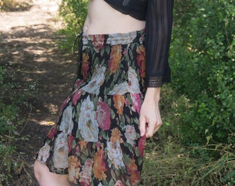 Vintage 80's black tiered mini Indian peasant skirt in dark florals.