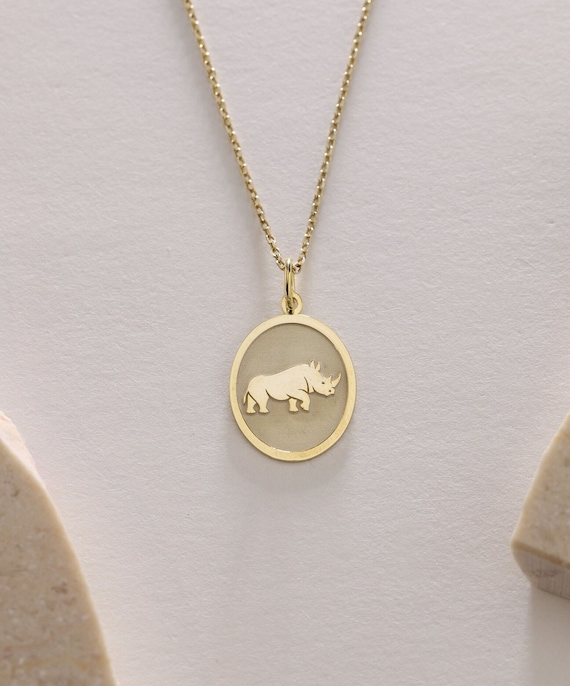 Gold rhino pendant deals
