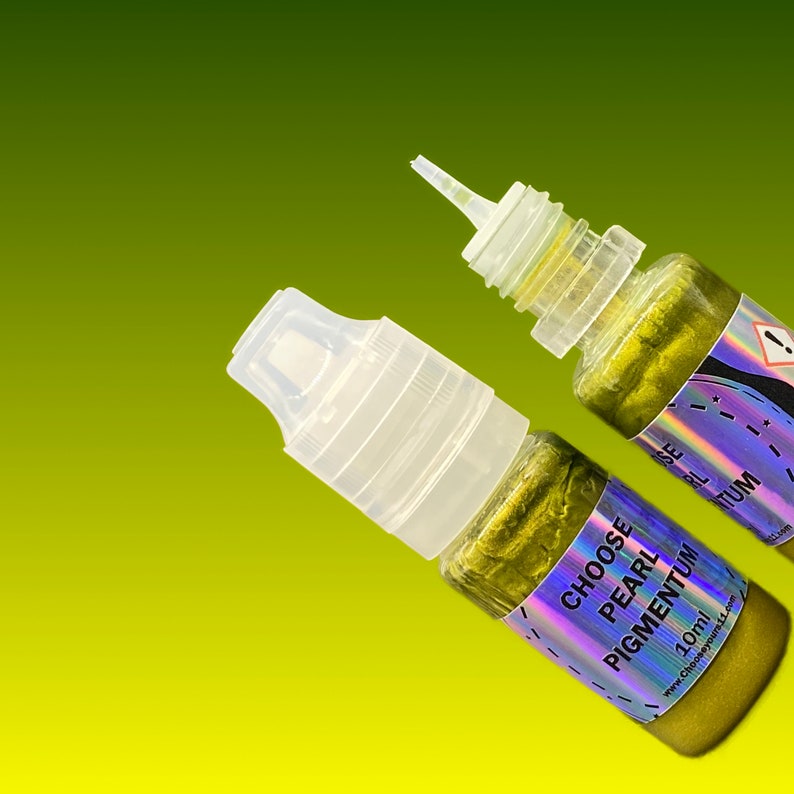 May include: Two 10ml squeeze bottles containing gold-toned pearl pigmentum. Each bottle features a clear plastic cap and a holographic label with the text CHOOSE PEARL PIGMENTUM 10ml and a website address printed in black ink.