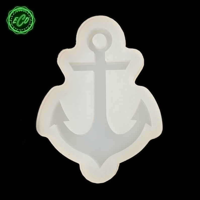 May include: White silicone mold shaped like an anchor. The mold is designed for making resin crafts.