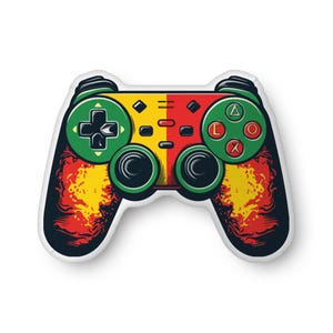 May include: A colorful gaming controller pillow with a red, yellow, and green design. The pillow is shaped like a traditional video game controller with buttons and joysticks.