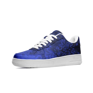 May include: Blue and black patterned sneakers with white laces and a white sole.