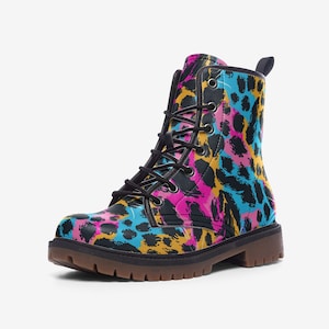 May include: Black leather boots with a colorful leopard print pattern. The boots have a lace-up closure and a chunky sole.