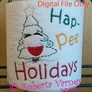 May include: A white toilet paper roll with an embroidered design of a Christmas tree with a red mouth and green leaves. The text "Hap. Pee Holidays" is embroidered in yellow and red. The text "Roberta Varney 2018" is embroidered in pink.