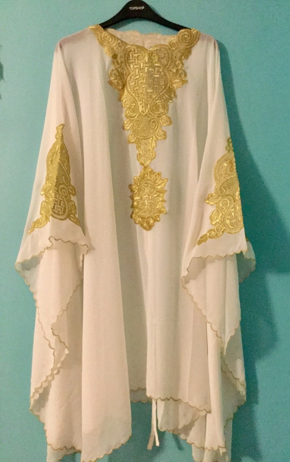 white and gold abaya