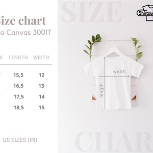 K&ouml;nnte beinhalten: Wei&szlig;es T-Shirt auf einem Kleiderb&uuml;gel mit L&auml;ngen- und Breitenma&szlig;en. Die Gr&ouml;&szlig;entabelle zeigt die Ma&szlig;e in Zentimetern f&uuml;r die Gr&ouml;&szlig;en 2T bis 5T. Der Text "Size chart" und "Shirtsurprise" sind ebenfalls sichtbar.