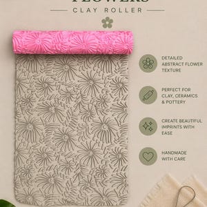 May include: A bright pink cylindrical clay roller featuring an embossed abstract flower pattern. The roller is positioned above a rectangular slab of beige clay that displays the same intricate floral impression. A metal loop tool is included.