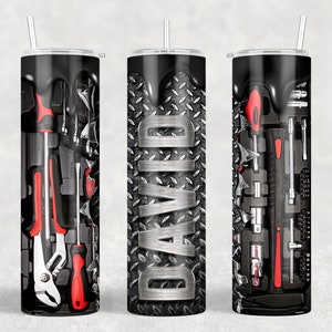 May include: Three stainless steel tumblers with a black and silver design. The center tumbler has the name "DAVID" printed on it. The tumblers on the left and right have a design of tools in a toolbox.
